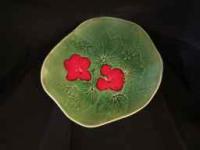 Green Stoneware Plate, with Red Flower1 by Birgitta Frazier